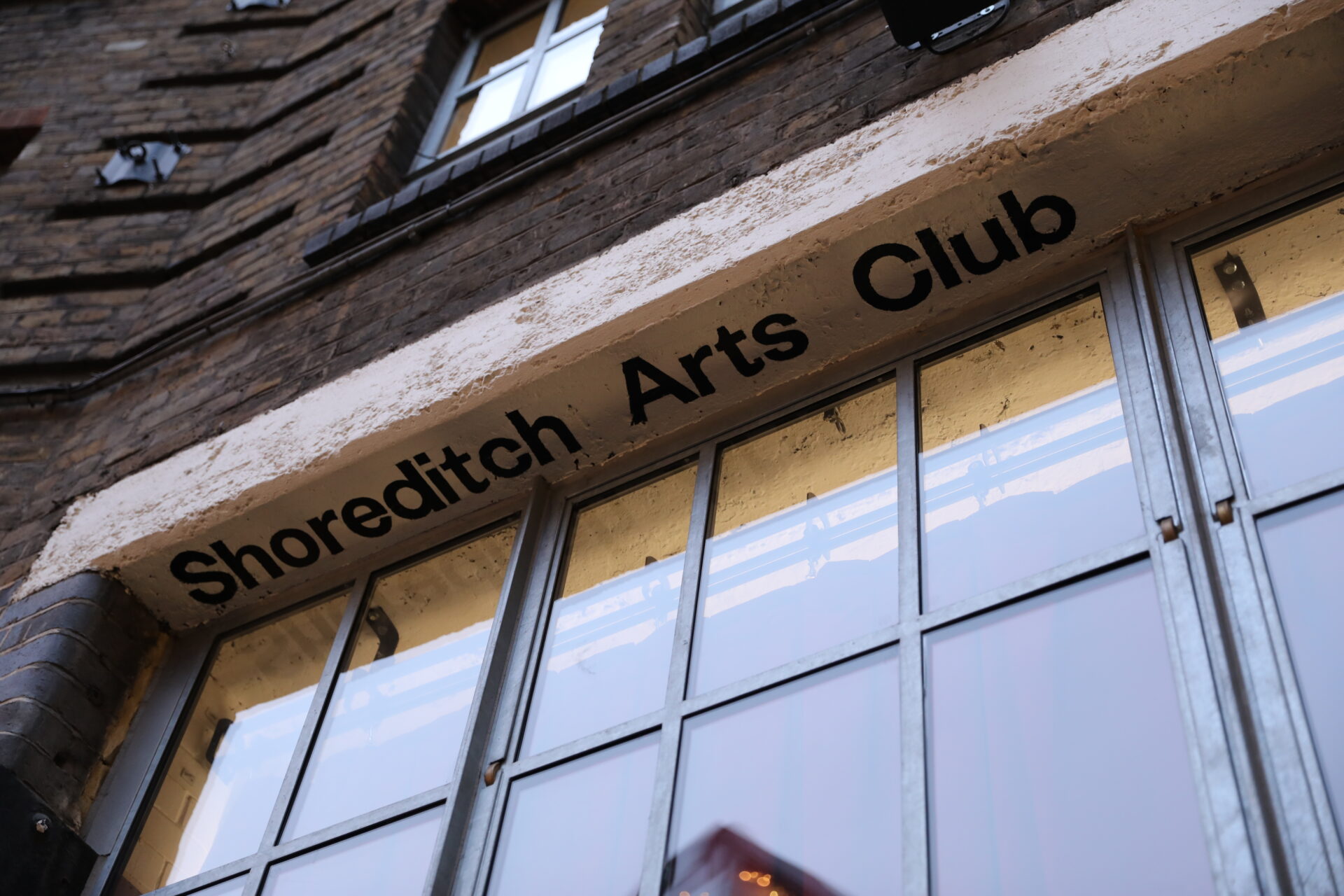 Shoreditch Arts Club sign writing on property
